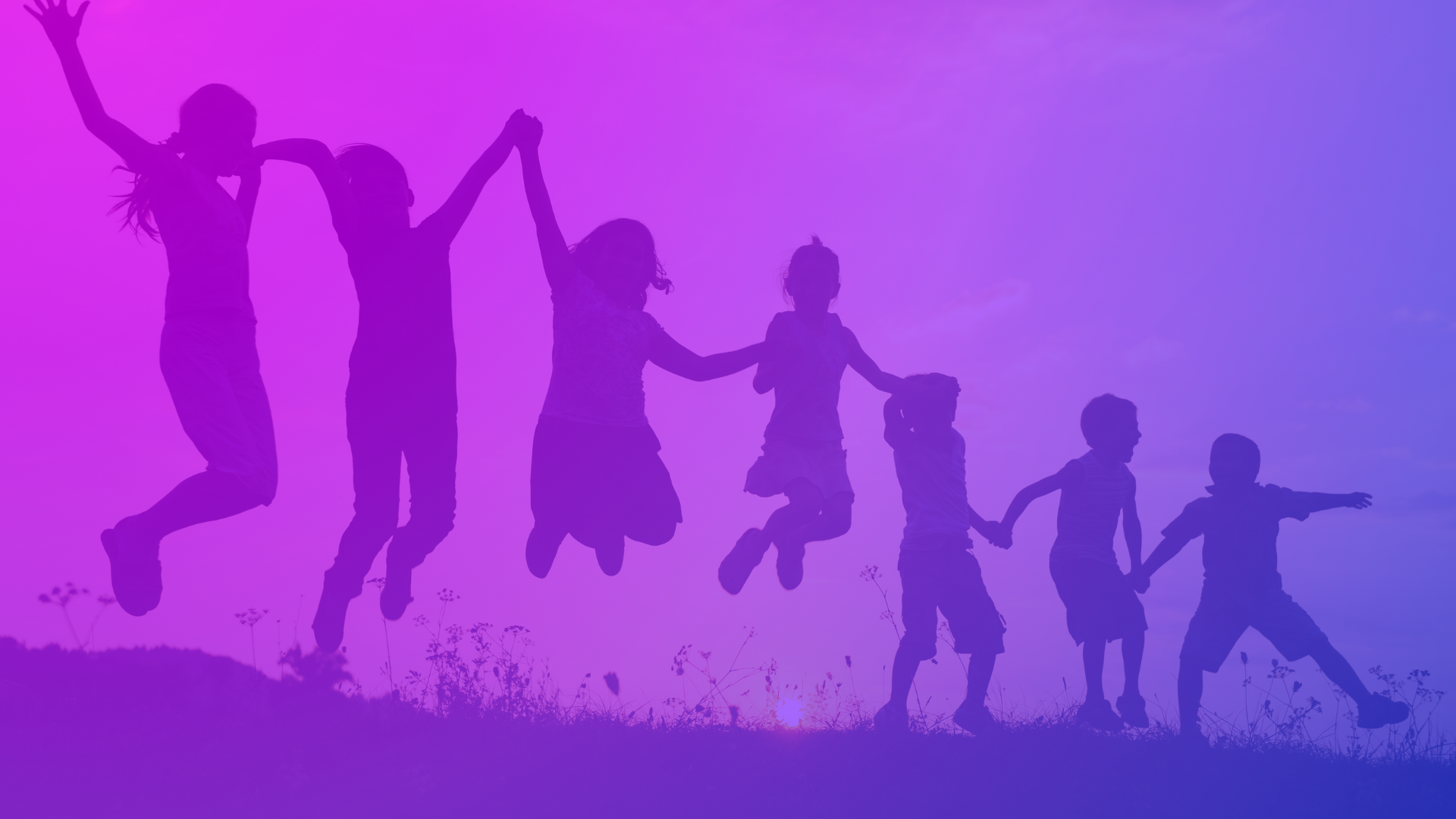 Children jumping together at sunset — joyful silhouettes against a magenta-to-violet sky